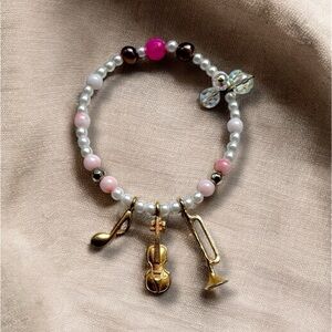 Recycled Pink Beads Faux Pearl Bracelet with a Gold Charm Music Instruments